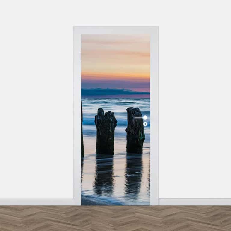 Deursticker Zonsondergang aan strand