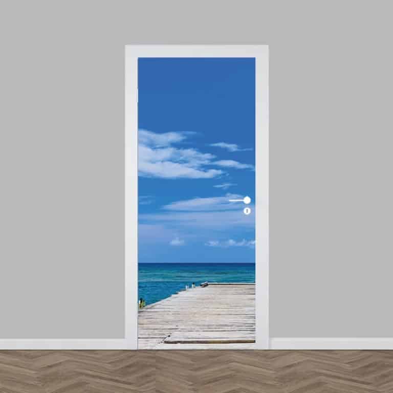 deursticker steiger op het strand